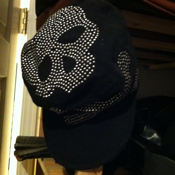 Black cap with skull and cross bones