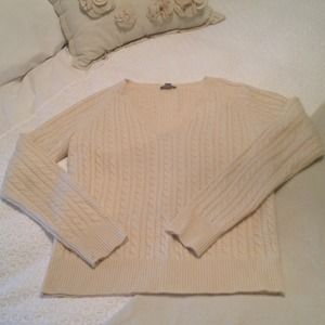Cream colored sweater.