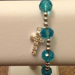 Baby blue bracelet with bling cross