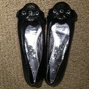 Shiny black flats