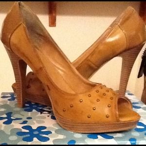 Size 10 light tan studded open toe heel.
