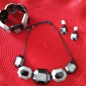 A necklace, earrings, and bracelet set very lovely