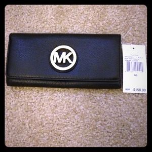 New Michael Kors black genuine leather wallet.