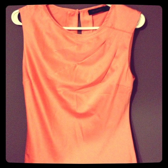 Limited sleeveless coral blouse.