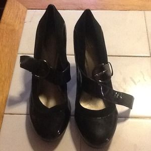 A pair of navy blue pattern leather & suede shoes