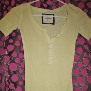Yellow Abercrombie kids top with buttons.