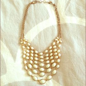 Amrita Singh necklace and salmon earrings