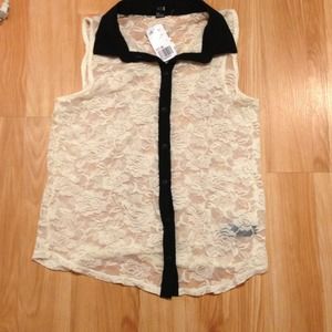 Sleeveless black and white lace top with collar