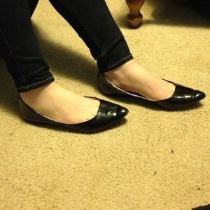 Black pointed toe flats.