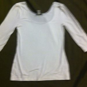 Three quarter sleeve white shirt.