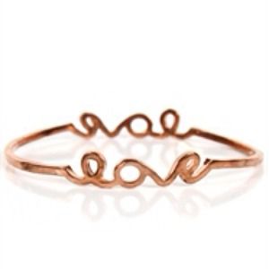 Rose gold tone "love" bangle