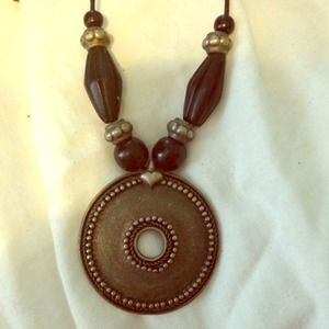 Medallion and beaded necklace.