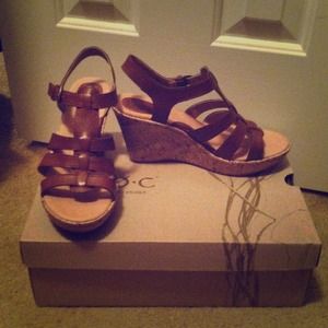 New, Born Concept, brown leather sandals.