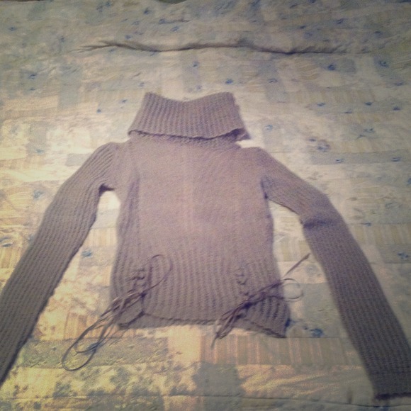 Cozy light blue sweater with ribbons