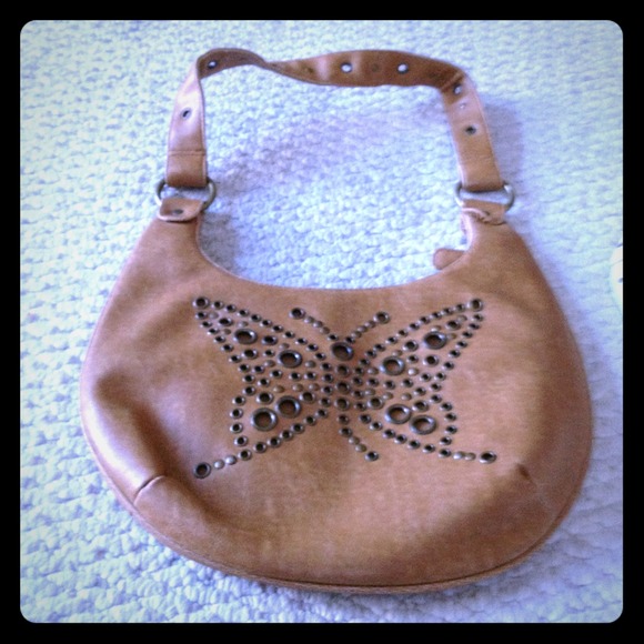 Brown leather purse with a butterfly as Decor