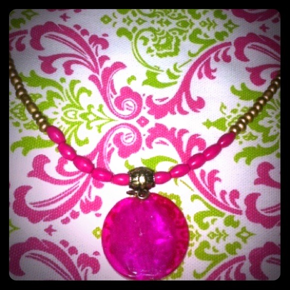 Hot pink glass medallion with gold bead necklace