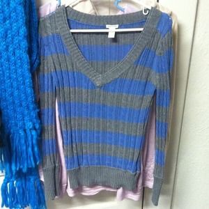 Long sleeve striped sweater shirt.