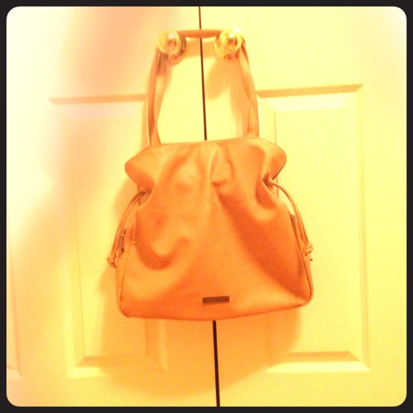 Original dust bag included.