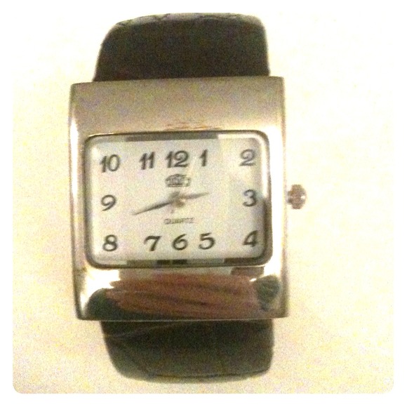 Brown safari leather cuff with large metal frame