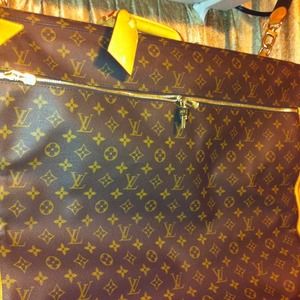 Louis Vuitton garment bag. Used once. 727-623-8847