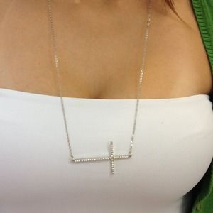Slanted cross necklace.