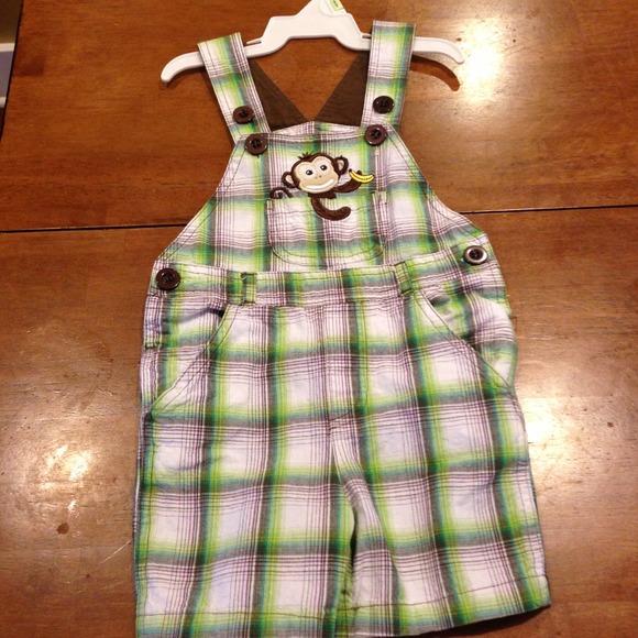 Infant green plaid overalls with monkey.
