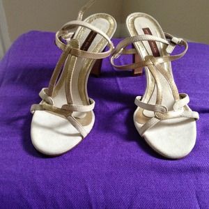 Very cute cream and gold suede sandal.  Size 5.5