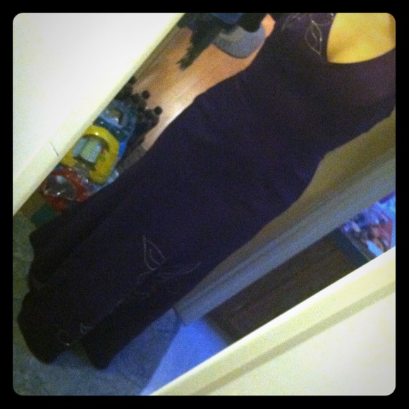 Dark purple, rhinestone embellished formal gown.