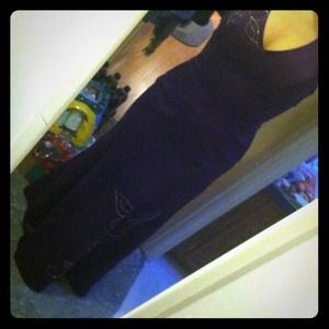 Dark purple, rhinestone embellished formal gown.