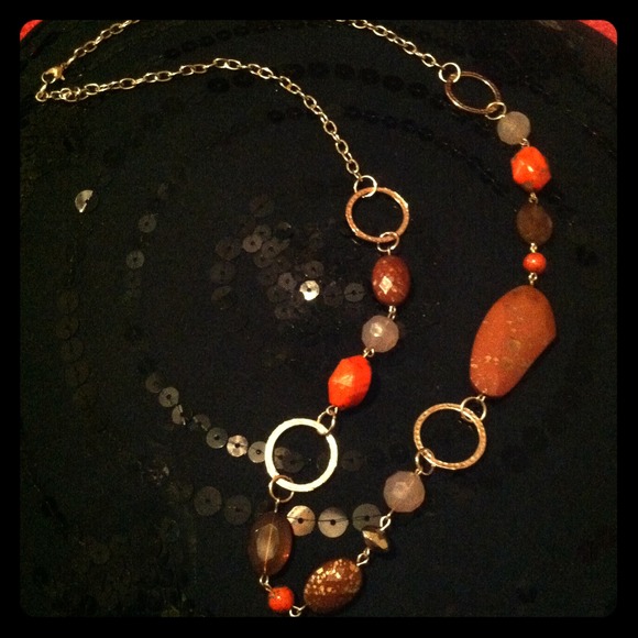 Orange, brown, and gold necklace.