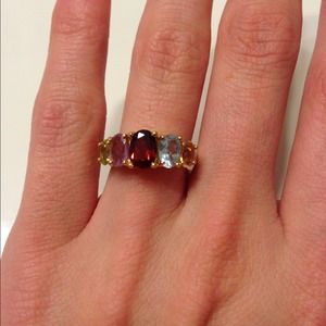 Multicolored diamond ring with gold band.
