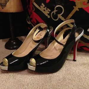 Christian Louboutin black& silver heels.