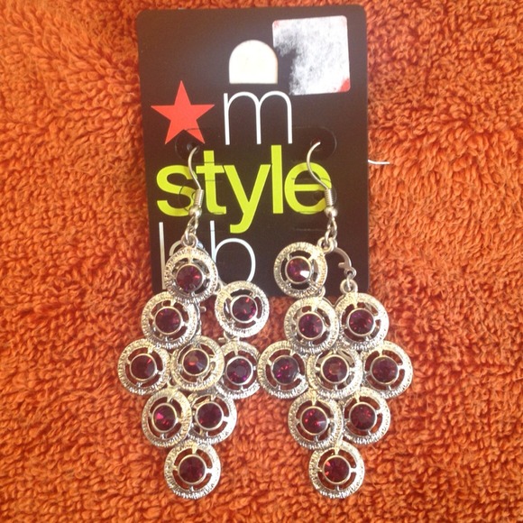Silver like earrings with purple stones