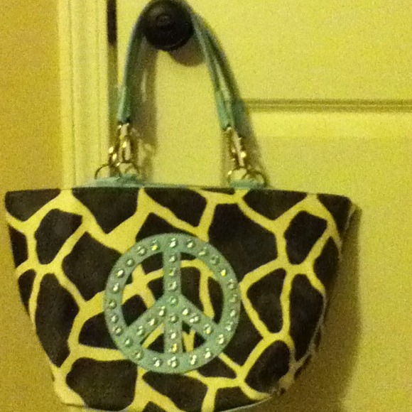 Giraffe design bag with peace sign embellishment