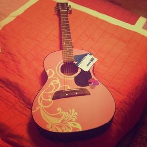 First act acoustic guitar, chord cards, picks.