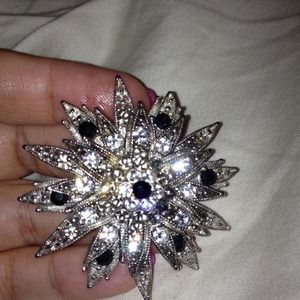 Black and silver pin