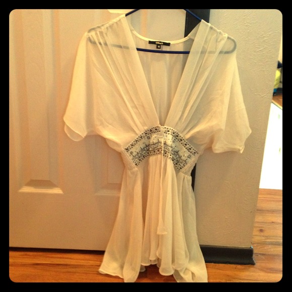 Cream colored top with beads