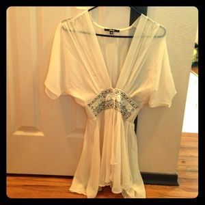 Cream colored top with beads