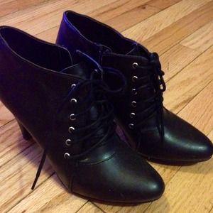 Used once only. Black ankle shoe lace booties.