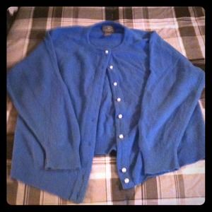 Super soft cardigan with faux pearl buttons.
