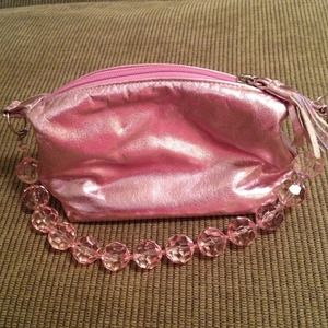 Baby pink leather handbag with bubbly strap!