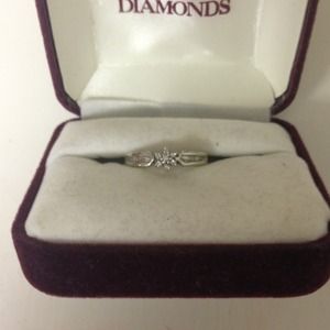 Diamond flower ring in white gold setting