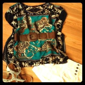 Blue/brown top with brown belt.