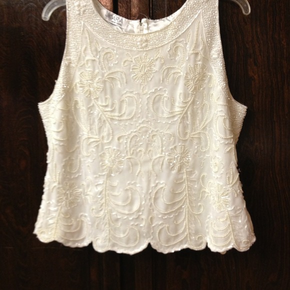 Beautiful white off shirt. The brand Is JK ARA.