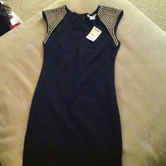 Black cocktail dress with gold shoulders