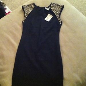 Black cocktail dress with gold shoulders