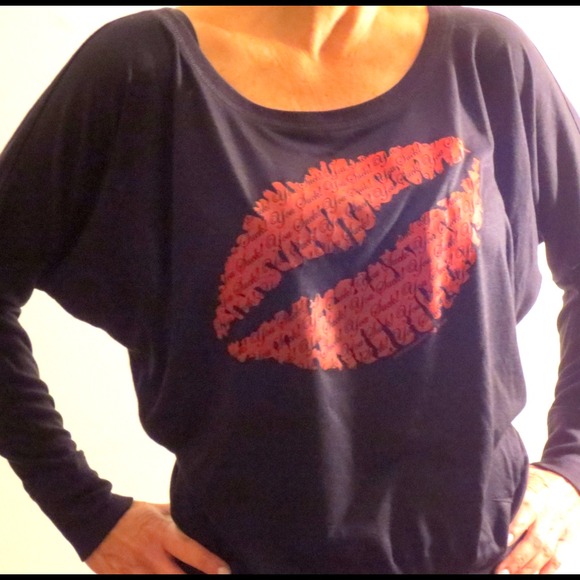 Black slouchy shirt, the lips say “You Suck”