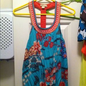 Fun and flirty tank. Stretch waist at bottom.