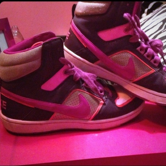 Magenta, purple, orange, gold, and white Nikes