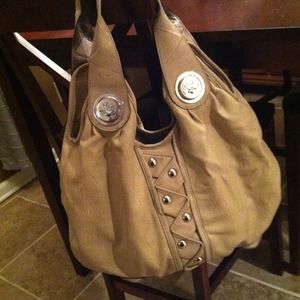 Kathy Van Zeeland tan hobo bag with silver studs.